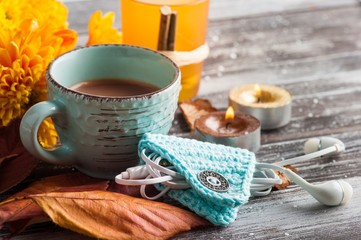 Yellow chrysanthemum, lit golden candles and leaves