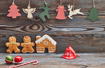 Christmas homemade decoration, gingerbread house and couple - man and woman.