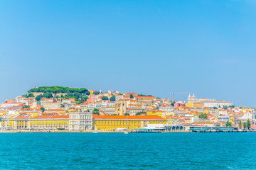 praca do comercio square with the saint george castle in Lisbon viewed from Tajo river, Portugal.