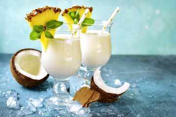Traditional caribbean cocktail pina colada in a glasses. - obrazy, fototapety, plakaty