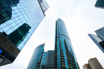 Skyscrapers in downtown. Modern city buildings exterior design, glass facades.
