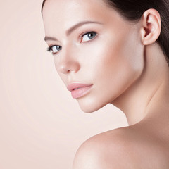 Fototapeta premium Young beautiful woman with clean perfect skin close-up