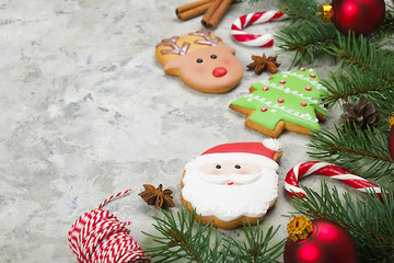Mixed Christmas cookies Colorful mix of Christmas-themed decorated cookies top view on gray concrete texture table.