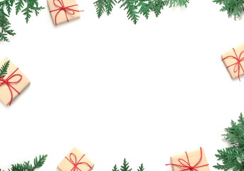 Fototapeta na wymiar Christmas gift boxe and fir tree branch on white background. Top view.