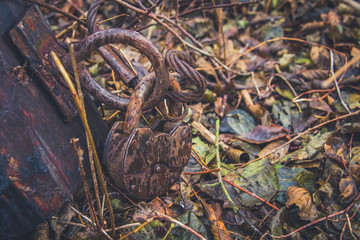 Old lock and rusty chain on a wooden boat