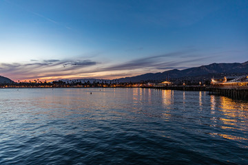 view city from shore pink clouds and blue sky at the dusk