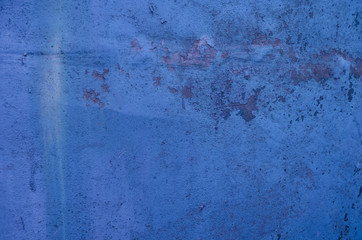Textured vintage painted blue wall background.