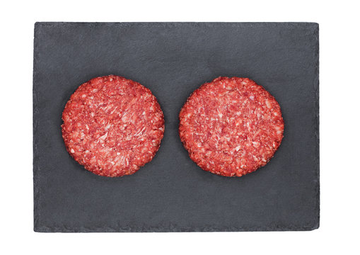 Raw Fresh Beef Burgers On Stone Plate