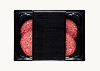 Raw fresh beef burgers in plastic tray