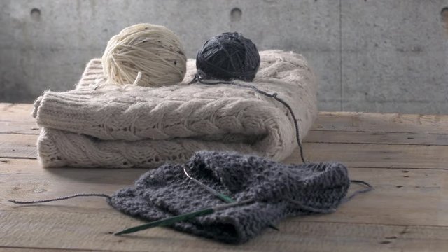 Vintage Knitting needles and yarn on wooden background/natural wool knitting background