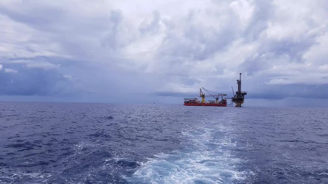 Tender assisted drilling rig in the middle of the ocean view from the crew boat
