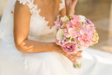 abstract blurring of a bride with a bouquet