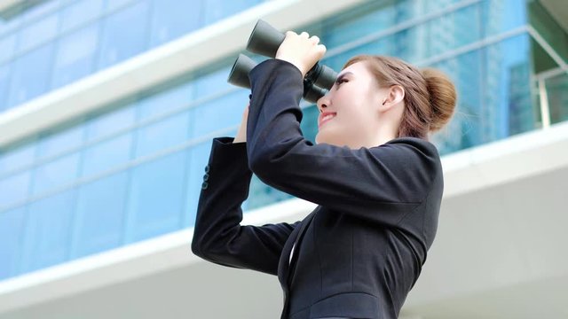 Business woman with binocular