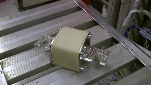 Big electric fuse moving in data center. Reflection.