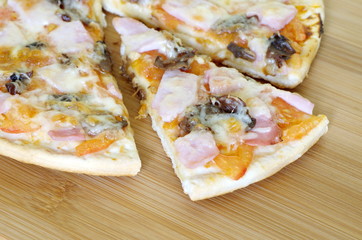 Pizza assorted on a wooden board