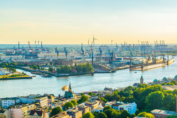 Beautiful view of famous Hamburger Landungsbruecken and industrial port on Elbe river in Hamburg, Germany