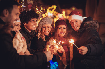 Friends With Sparklers At The New Year Party