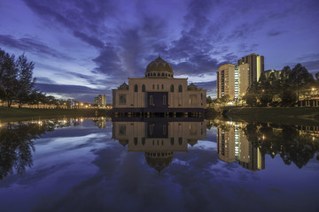 Reflection of the mosque with a nice sky background on blue hour sunset / sunrise view