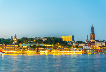 View of the Elbe riverside with the hamburger landungsbruecken building, saint michaelis church and...