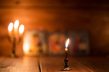 burning candle in a dark room, orthodox