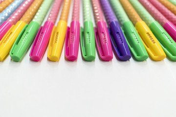 A pencil case, pens, pencils, notebook, notebooks lie on the table.