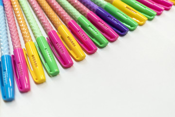 A pencil case, pens, pencils, notebook, notebooks lie on the table.