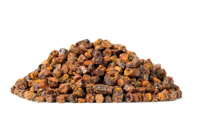 Propolis granules isolated on white background, bee product