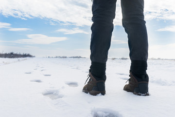 Woman is walking on the snow