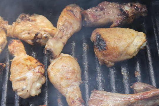 Grilling delicious variety of meat on barbecue grill