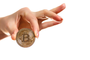 Fototapeta premium Isolated of hand putting a bitcoin concept human hand with bitcoin hand with bitcoin