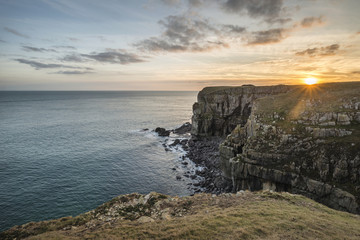 Naklejka premium Stunning vibrant landscape image of cliffs around St Govan's Head on Pembrokeshire Coast in Wales