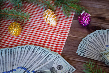 American dollars as a Christmas gif t or a Christmas spending concept