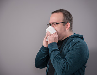Man Blowing Nose