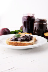 Fresh plum jam with toast or bread for breakfast