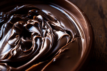 Sweet Dark Chocolate Cream in a brown  bowl.
