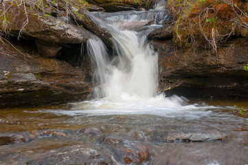 Fototapeta premium Small waterfall in mountains of northern Norway