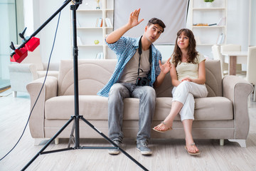 Young photographer working in photo studio