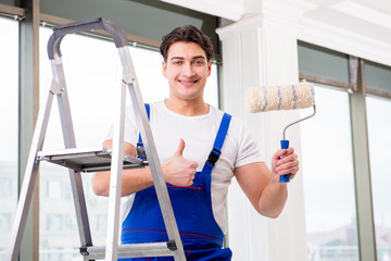 Painter repairman working at construction site