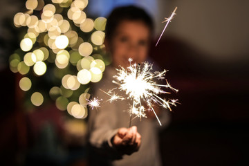 Child holding a small firework - 181292667