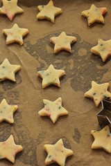 Fototapeta na wymiar Star shaped xmas raw sugar cookies ready to bake / Christmas baking