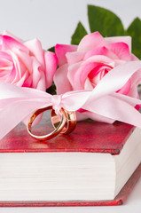 Wedding concept with rings and roses