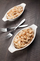 
Freshly made pasta with creamy sauce and breadcrumbs on top vertical shot
