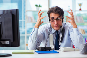 Unhappy angry call center worker frustrated with workload