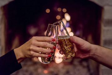 Champagne toast in front of fireplace