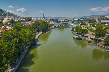 Fototapeta na wymiar TBILISI, GEORGIA - 31 July 2017: Panoramic View over Tbilisi City Center