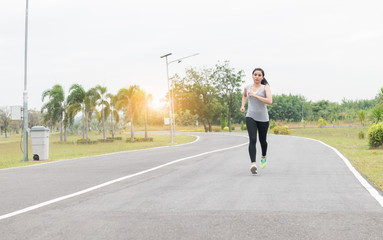 Running woman. Female runner jogging  at health park