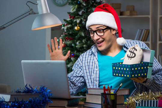 Young man working at home on christmas day