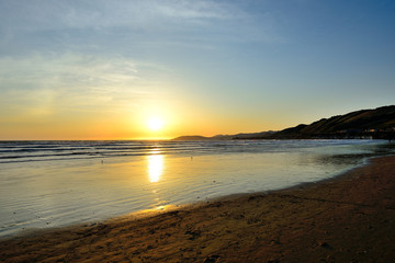 Evening sunset over the Pacific Ocean at Pismo Beach, California 