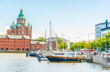 Uspenski Cathedral rising above kruununhaka marina in Helsinki, Finland