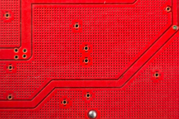 Closeup of electronic red circuit sound card board background